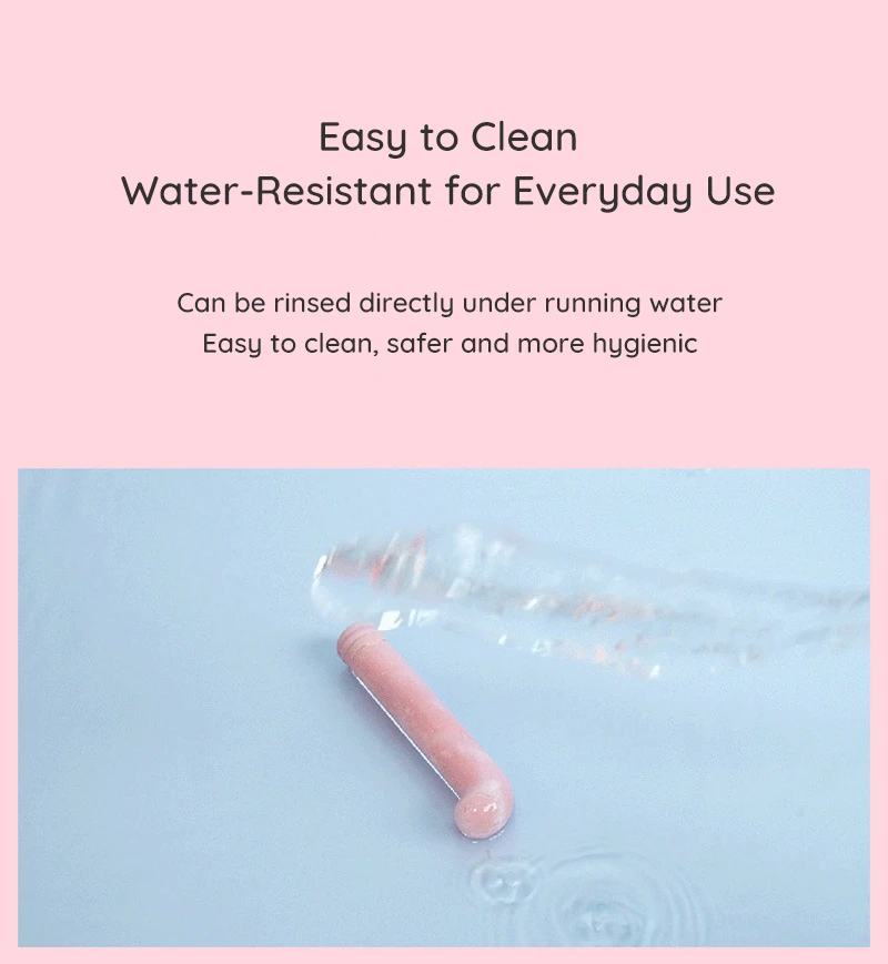Water-resistant curved vibrator shown under running water for easy cleaning