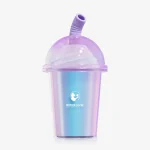 Iridescent mini cup suction vibrator with transparent dome lid and pastel straw detail on white background