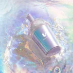 Waterproof iridescent pleasure tool displayed in shimmering water for easy-clean intimate care