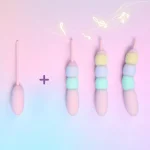 Modular candy bead vibrator set showing base bullet module plus multiple pastel attachment combinations