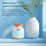 Discreet candy jar style vibrator storage displayed beside home decor for stylish private organization