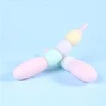 Angled pastel modular vibrator with curved bead configuration highlighting customizable shape and soft matte finish