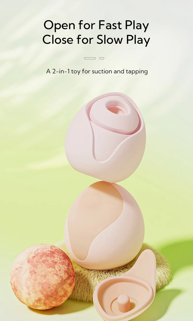 Peach shaped clitoral vibrator with removable cap and suction opening