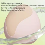 Peach clitoral vibrator with broad tapping coverage for lingering stimulation