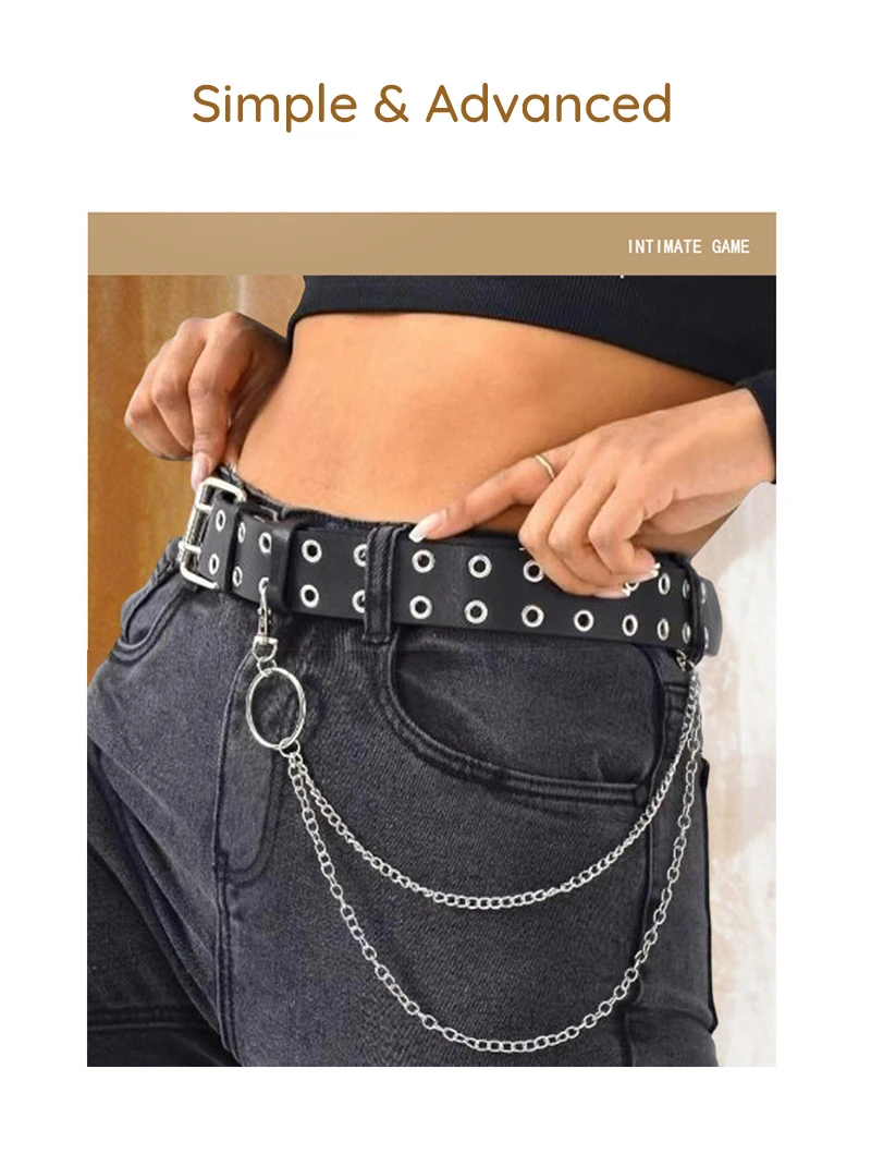 Black double grommet chain belt styled on jeans with layered silver chains