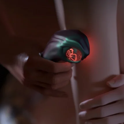 Close-up of handheld intimate massager with glowing tip against skin Discreet Sex Toys Brand - HooHss