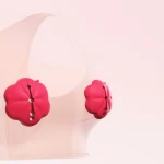 Pink flower-shaped nipple clips on sheer mesh top Discreet Sex Toys Brand - HooHss