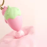 Strawberry keychain vibrating egg toy in pink and green close-up Discreet Sex Toys Brand - HooHss