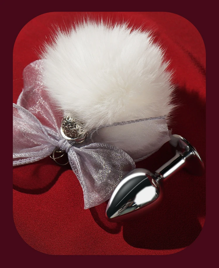 white bunny tail anal plug with satin bow on red fabric Discreet Sex Toys Brand - HooHss