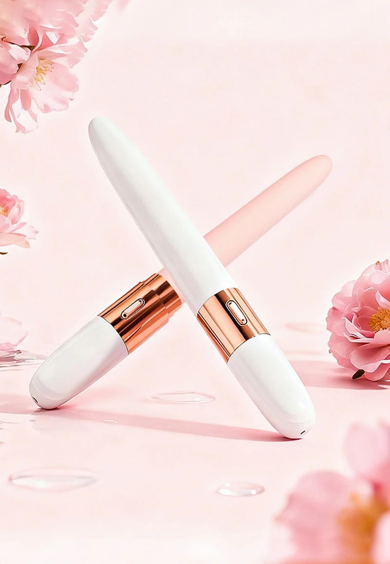 Slim beginner vibrator with tapered tip and rose gold accent on pink background Discreet Sex Toys Brand - HooHss